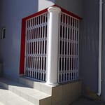 Trellis gate fitted in corner.