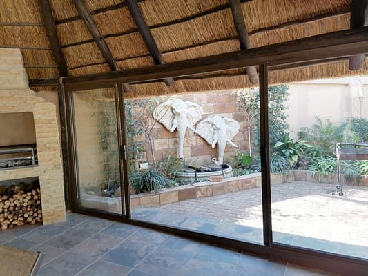 Enclosure of lapa With Four panel sliding door in Hartebeespoortdam open door,